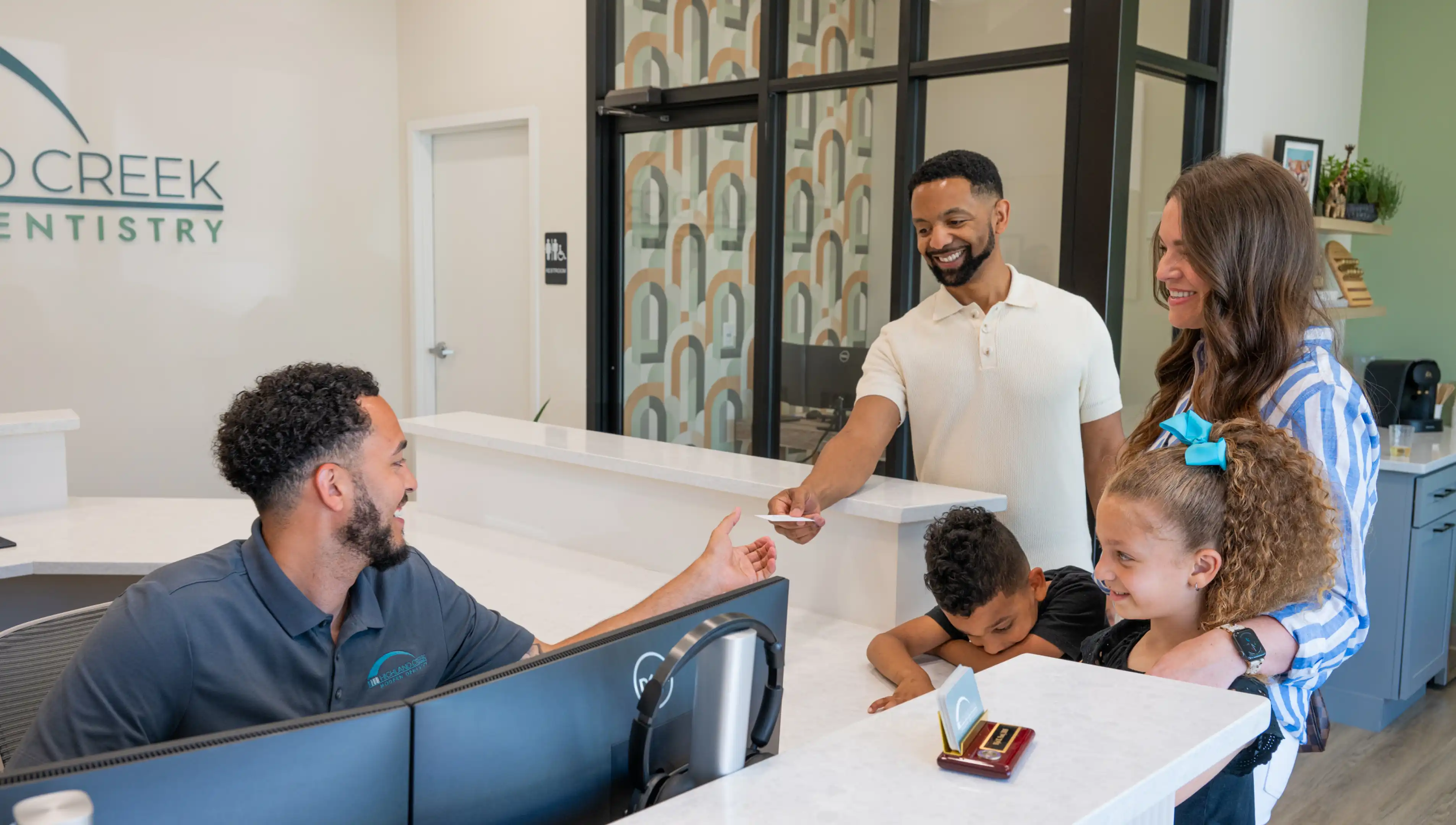 Modern Creek Modern Dentistry front desk team greeting patients